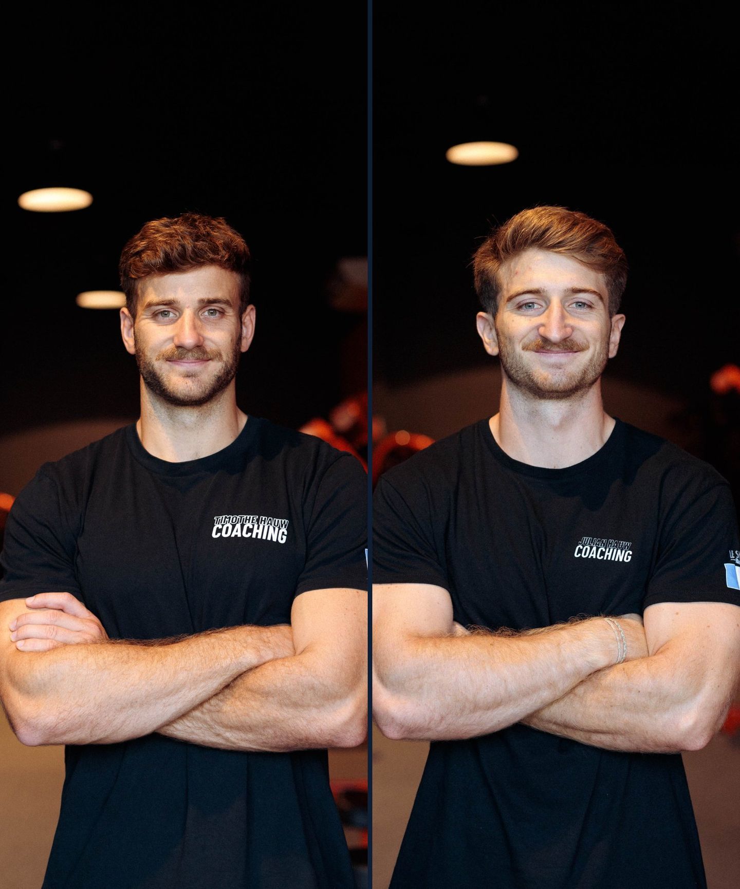 Two fitness coaches standing side-by-side with their arms crossed, wearing matching black t-shirts in a gym setting.