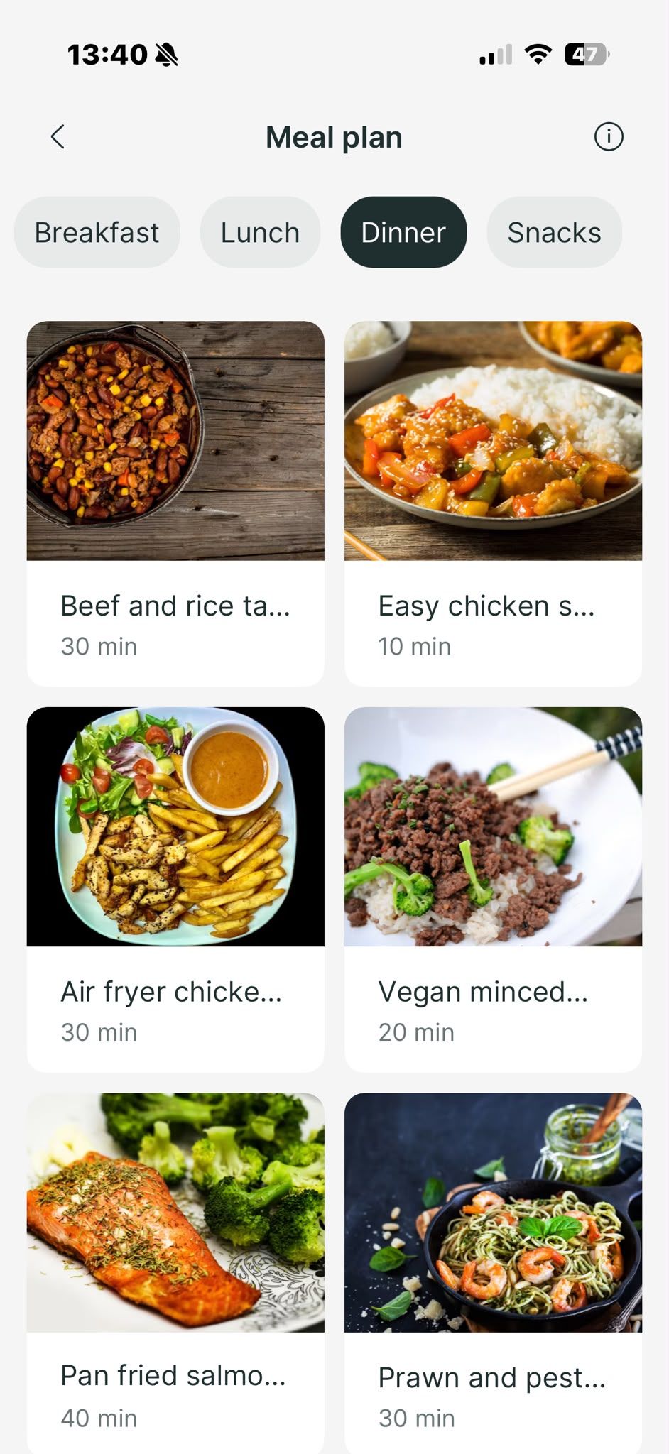 A mobile app interface displaying a grid of dinner meal options with photos, titles, and preparation times.