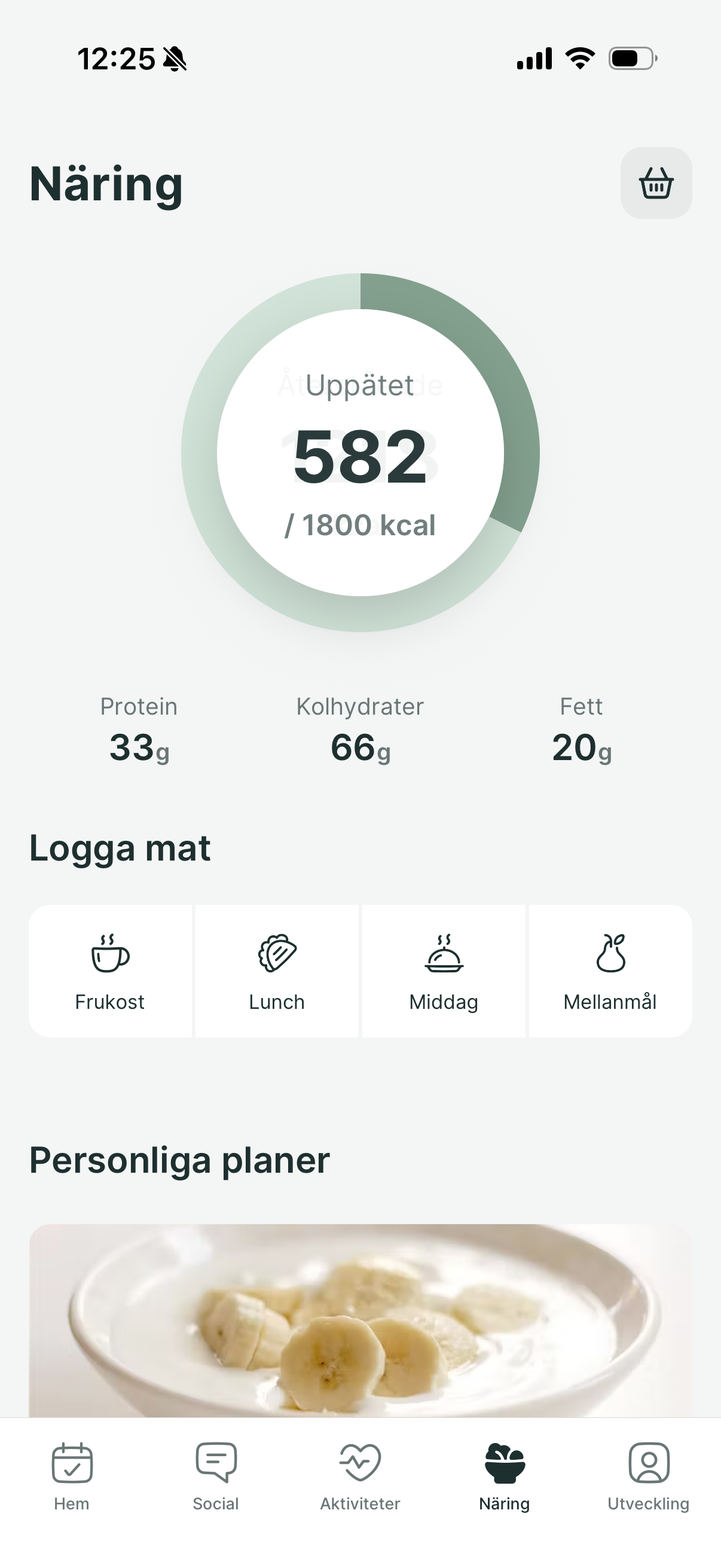 A mobile app interface showing a daily nutrition tracker with calorie intake, macronutrient breakdown, and meal logs.