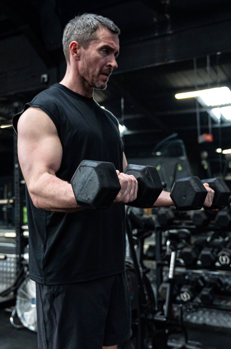 The coach is working out at the gym.