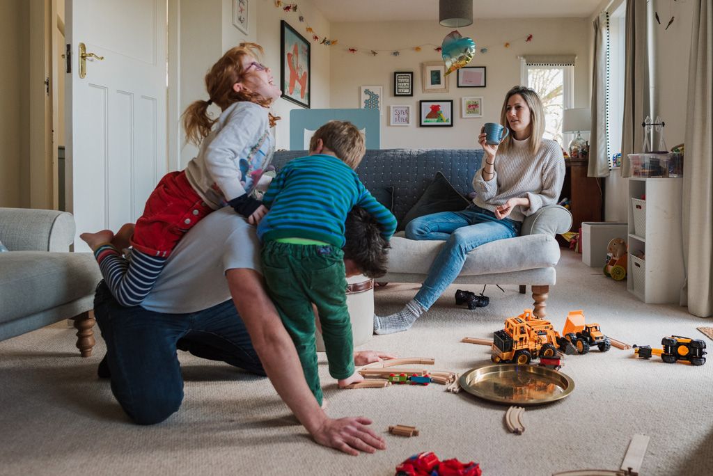 Coach with his family in a playful moment.