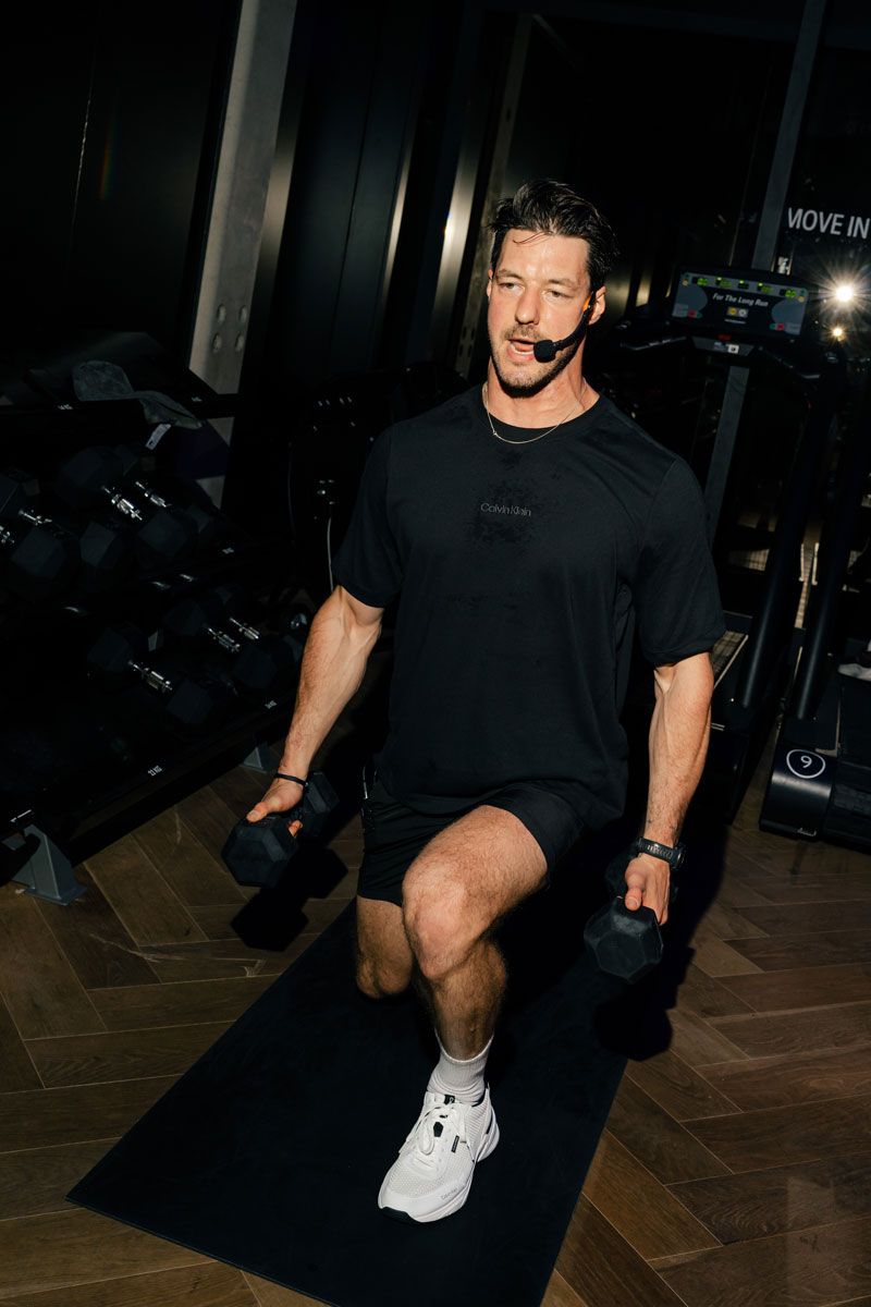 The coach is coaching at the gym.