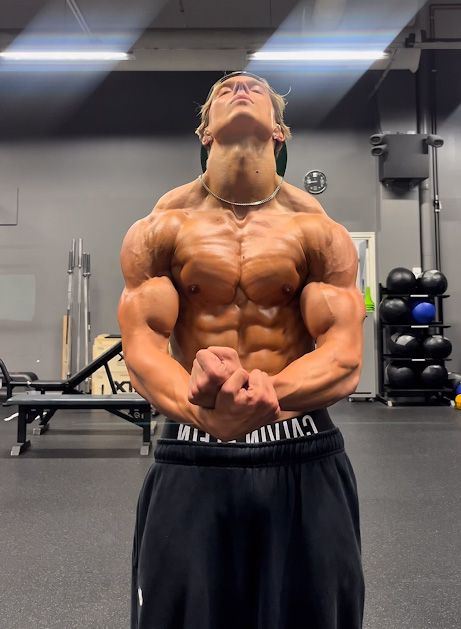 An image of the coach flexing