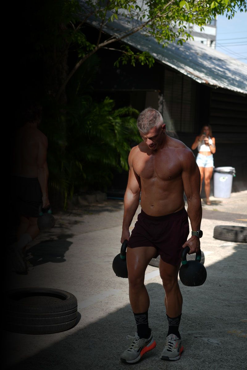 The coach is exercising outside.