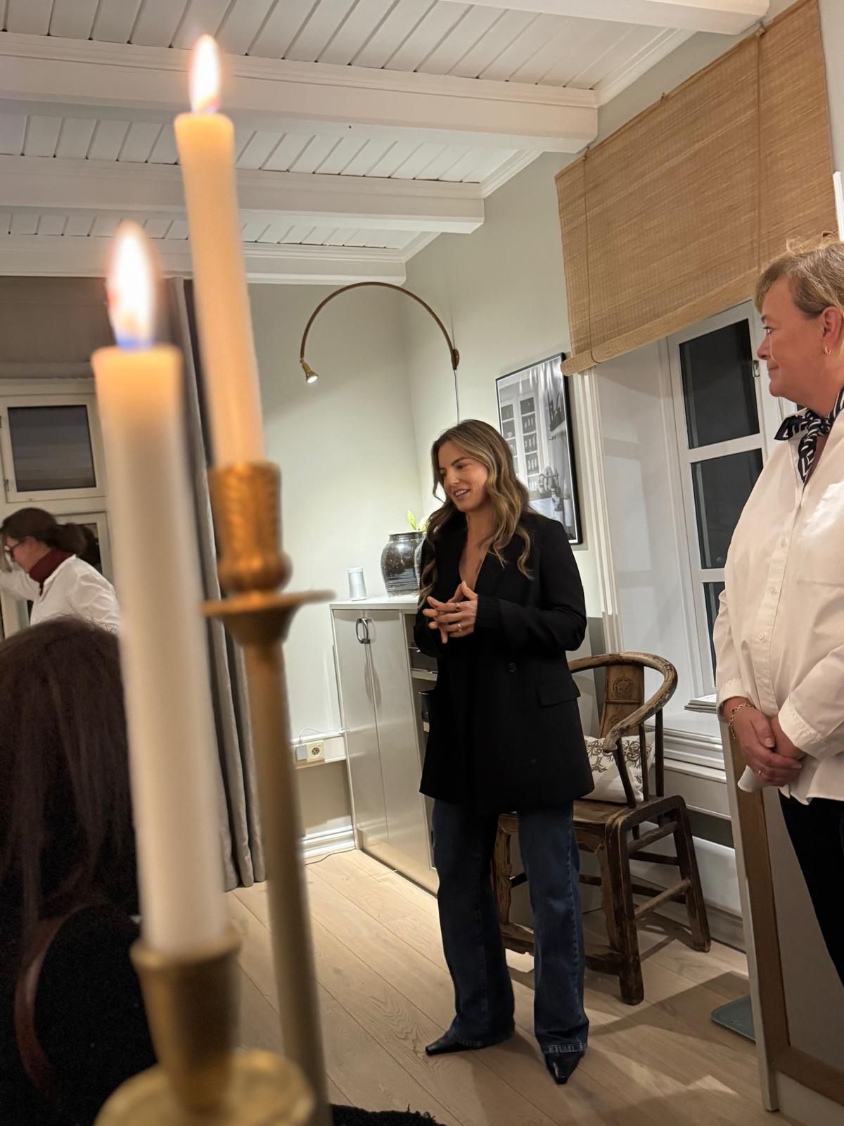 Savannah speaking with a group at an event